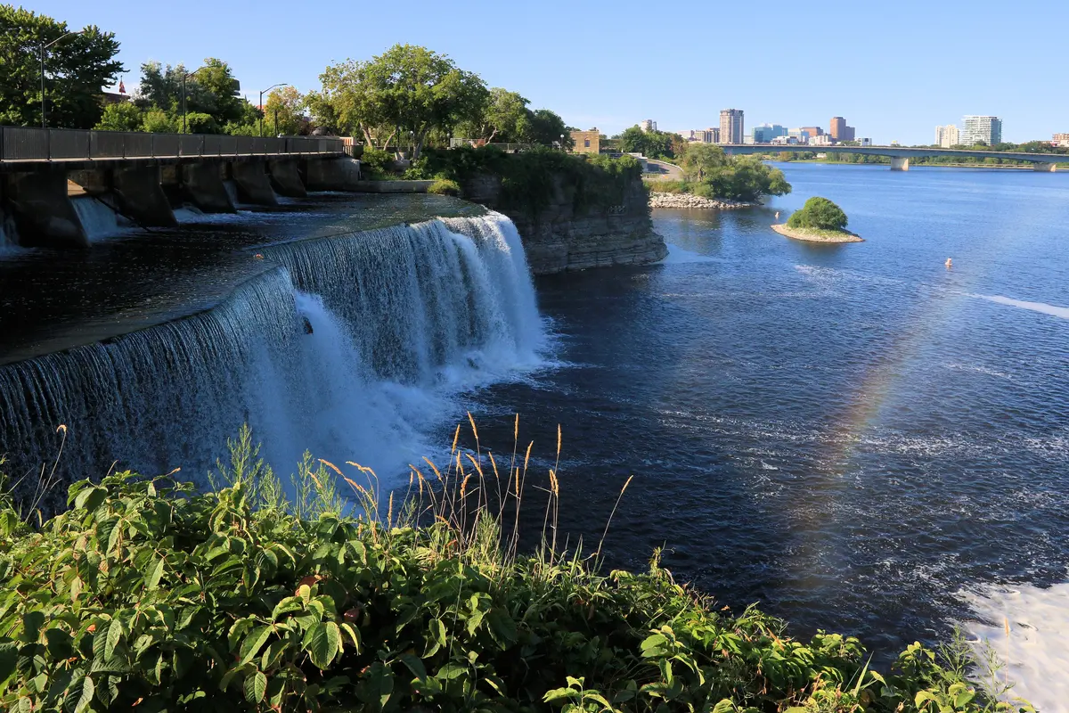 The twin Rideau Falls dropping over a ledge into the Ottawa River