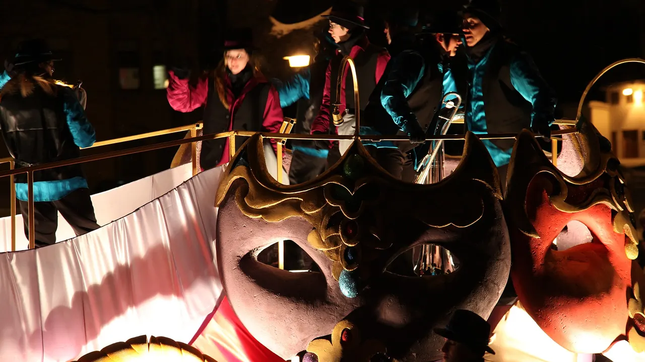 Ice sculptures and carnival crowds in the snow at the Quebec Winter Carnival