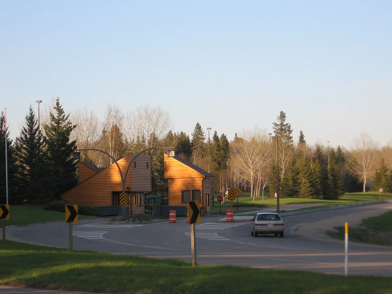 The Riding Mountain National Park entrance sign on a forest road