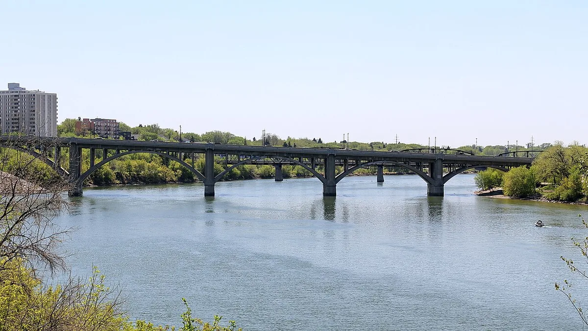 The stone arches of the Broadway Bridge spanning the South Saskatchewan River in Saskatoon