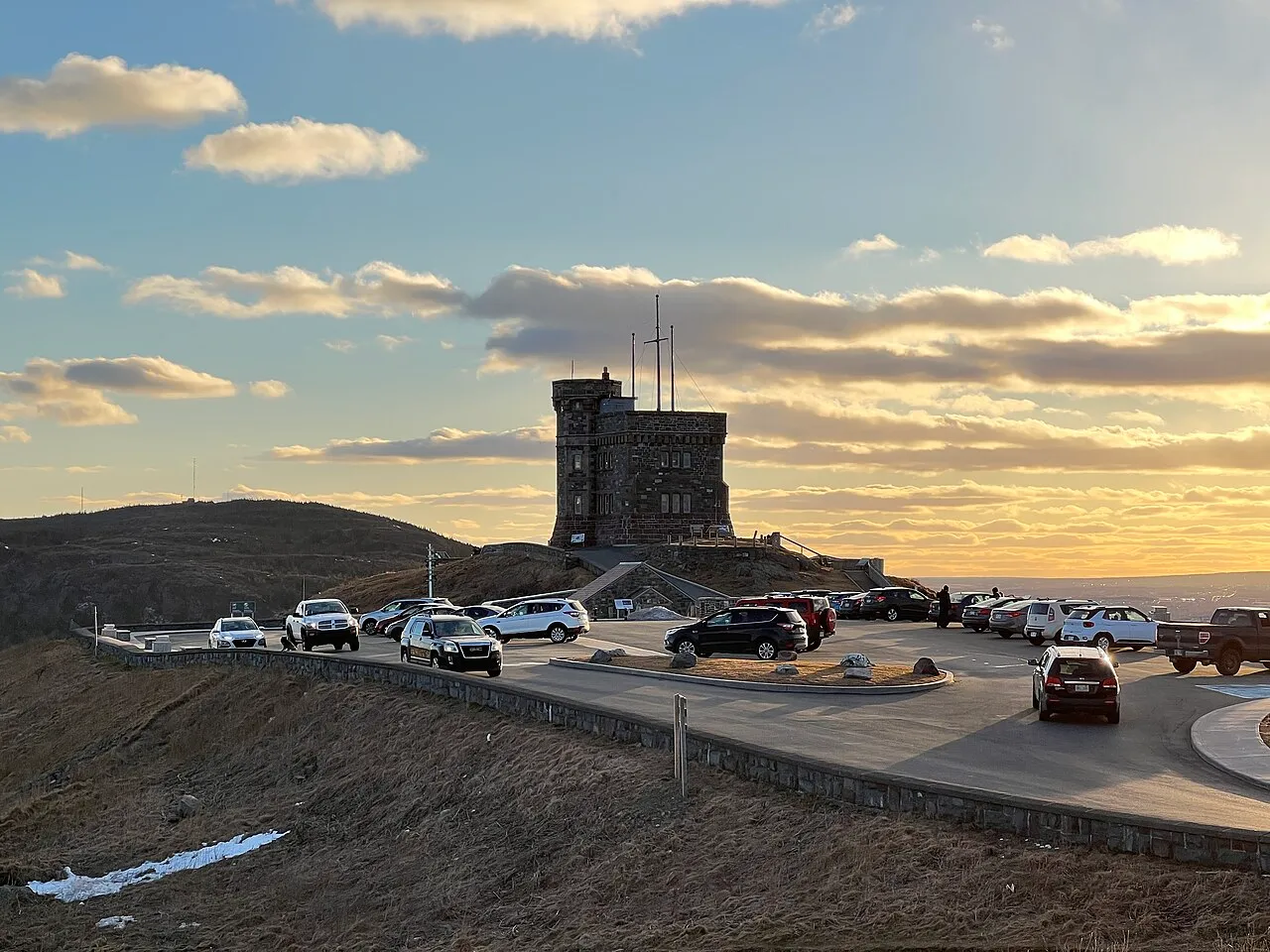Cabot Tower and Signal Hill National Historic Site rising above grassy slopes
