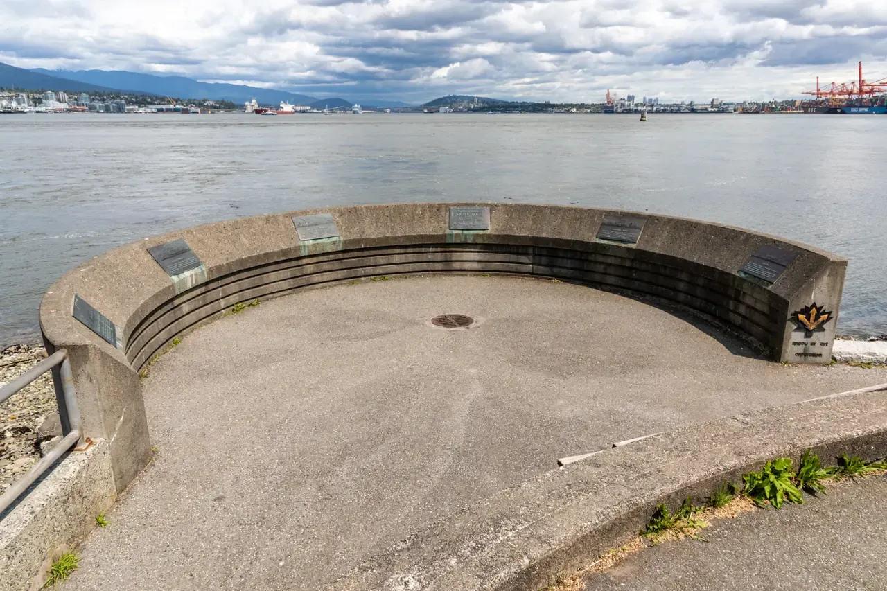 Looking across Burrard Inlet toward Vancouver harbour cranes from the Stanley Park seawall