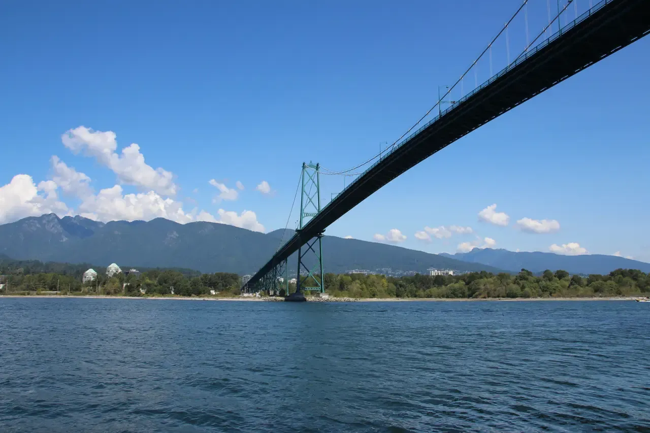 The Lions Gate Bridge spanning the First Narrows seen from the Stanley Park seawall path