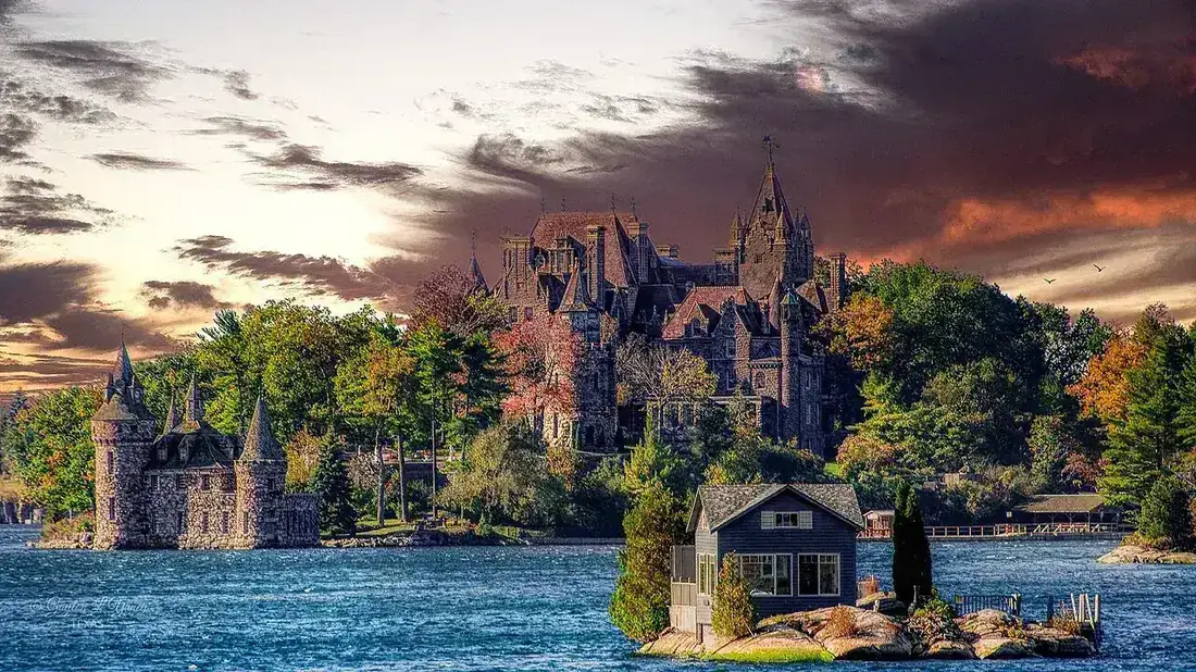 Boldt Castle on Heart Island seen across the water under a blue sky