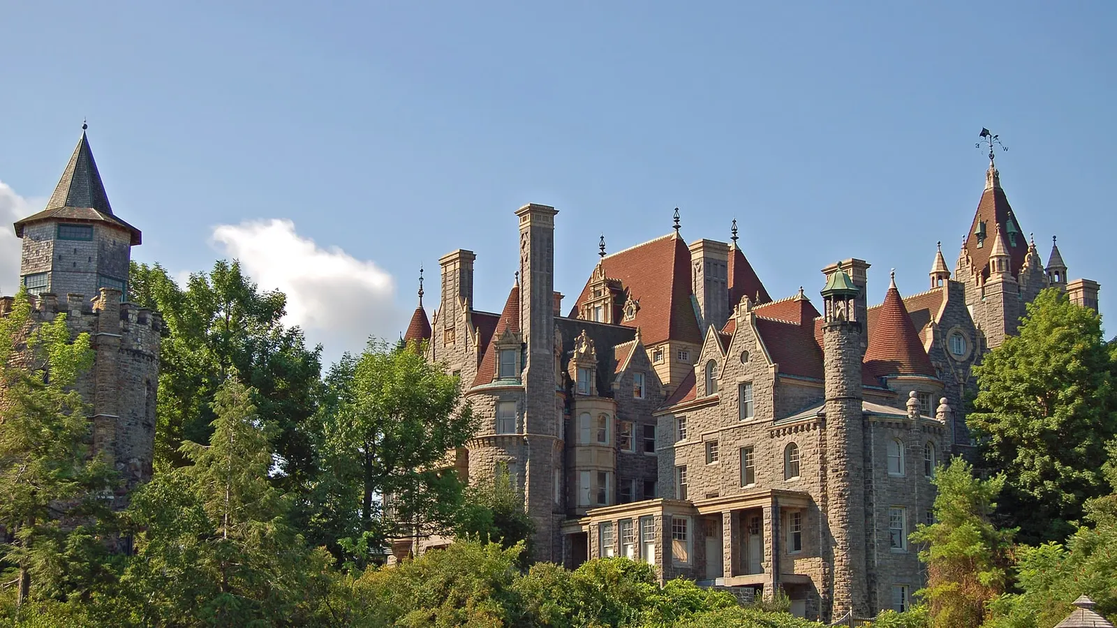 Boldt Castle on Heart Island, its stone turrets and red gabled roofs rising above the trees