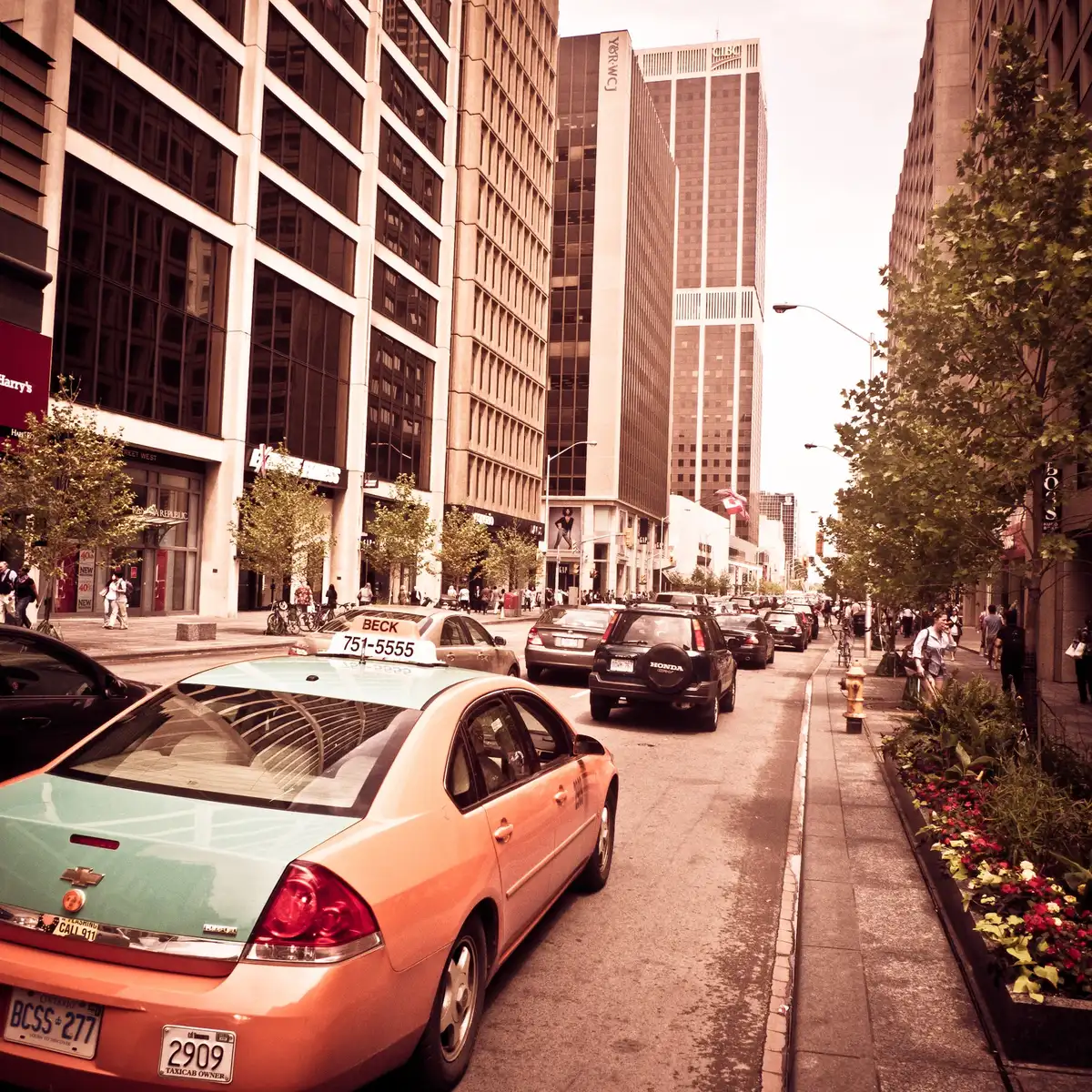 A taxi cab driving along Bloor Street in Toronto