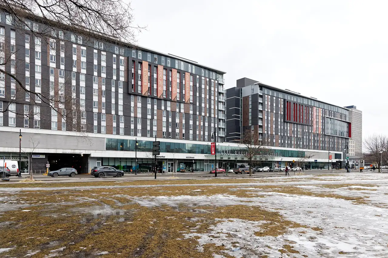 Exterior of Montreal coach terminal Gare d'autocars with buses at the curb