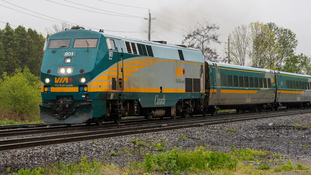 VIA Rail Corridor trainset moving through open countryside east of Toronto