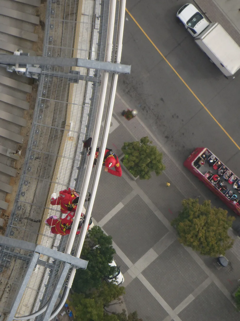 Looking straight down through the glass floor at the streets far below the CN Tower