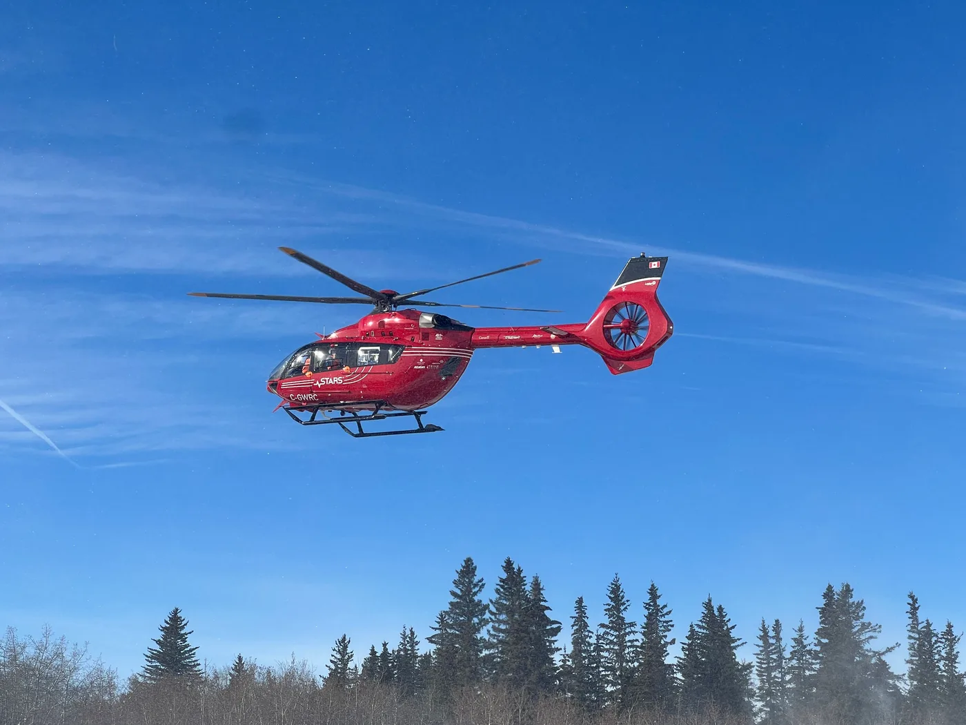 A red STARS air ambulance helicopter, the kind used for medical evacuation across western Canada