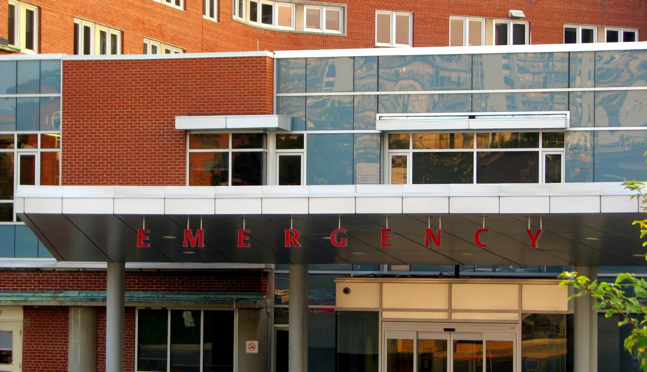 The illuminated Emergency sign and entrance at a Canadian hospital at night