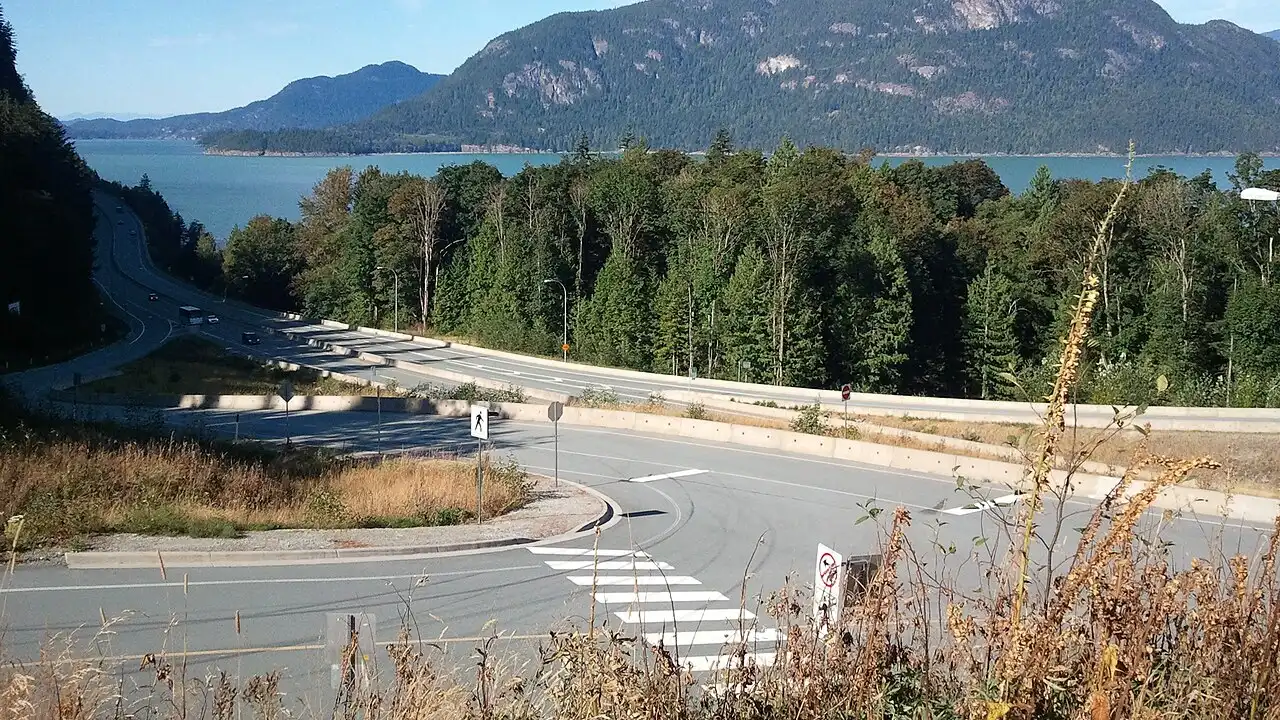 Highway 99 hugging the shore of Howe Sound on the Sea-to-Sky drive toward Whistler