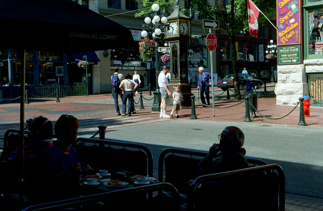 Brick heritage buildings and old-style lamp posts along a Gastown street in Vancouver