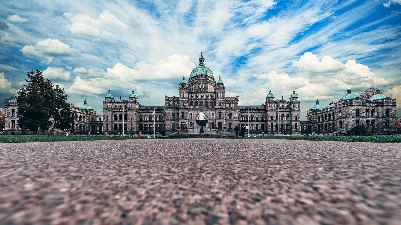 The domed grey-stone British Columbia Parliament Buildings on the waterfront in Victoria