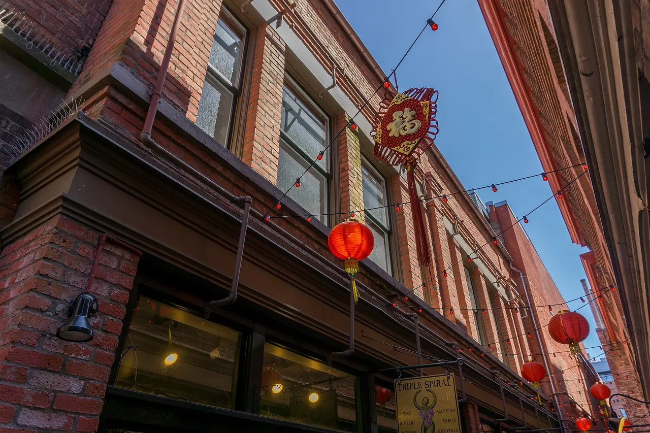 The narrow brick passage of Fan Tan Alley in Victoria's Chinatown