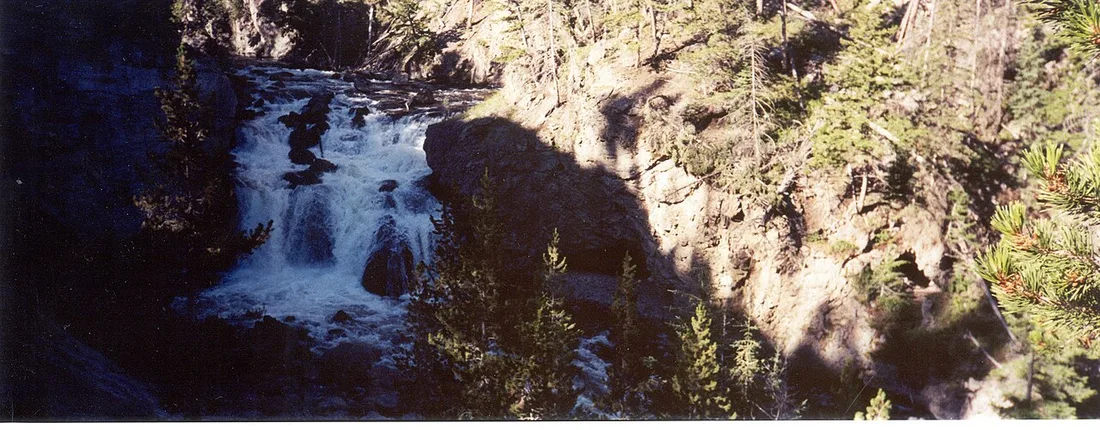 Blakiston Falls spreading over a wide rock ledge near Red Rock Canyon in Waterton Lakes National Park