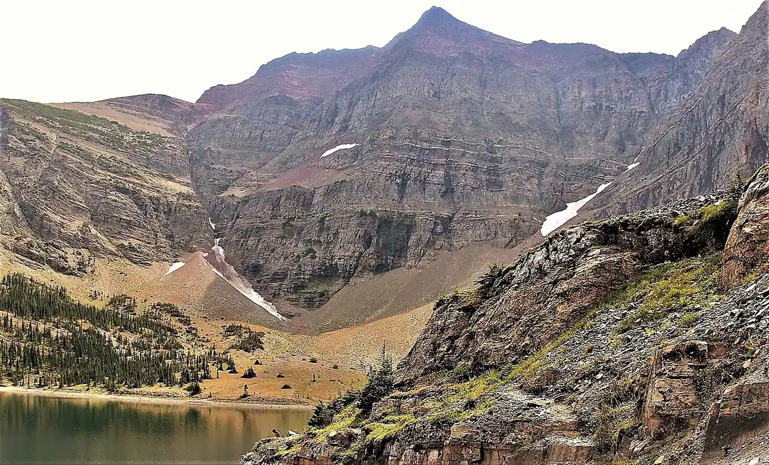 Crypt Lake surrounded by steep mountain walls at the end of the Crypt Lake trail in Waterton Lakes National Park