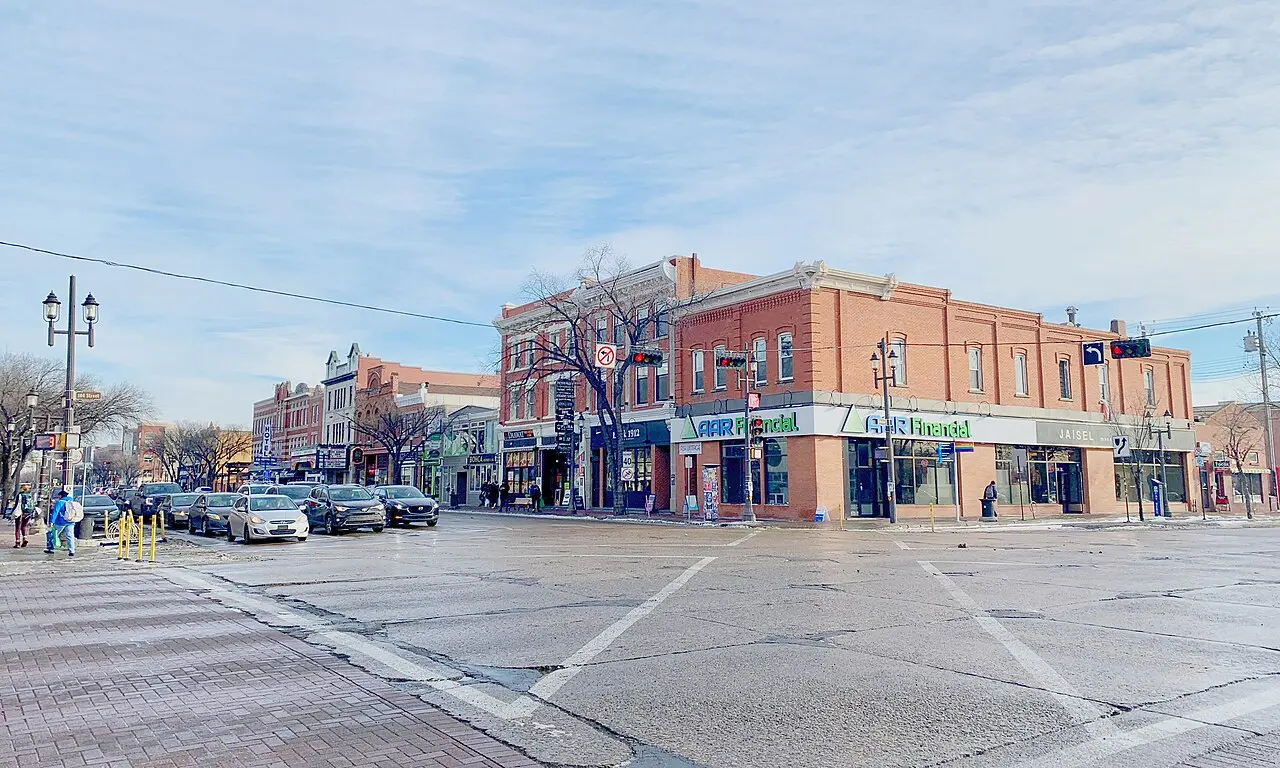 Whyte Avenue at 104 Street in Old Strathcona with shops and street trees