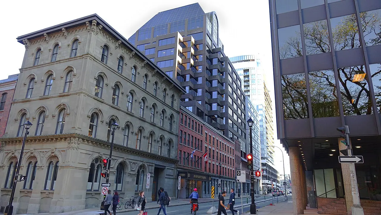 Nineteenth-century stone buildings on Hollis Street in downtown Halifax with glass towers rising behind them