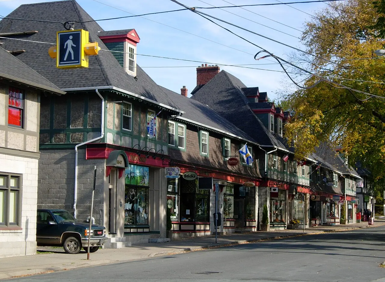 Shopfronts with awnings along the Hydrostone Market strip of concrete-block row buildings in the North End of Halifax