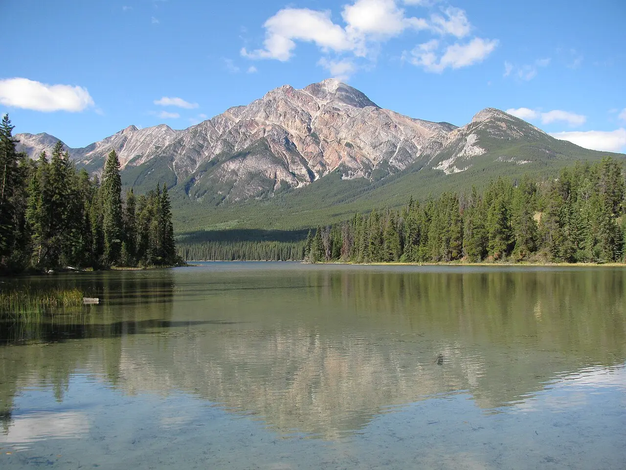 The Athabasca River flowing through forest near Jasper, close to where Becker's Chalets sits on the Icefields Parkway