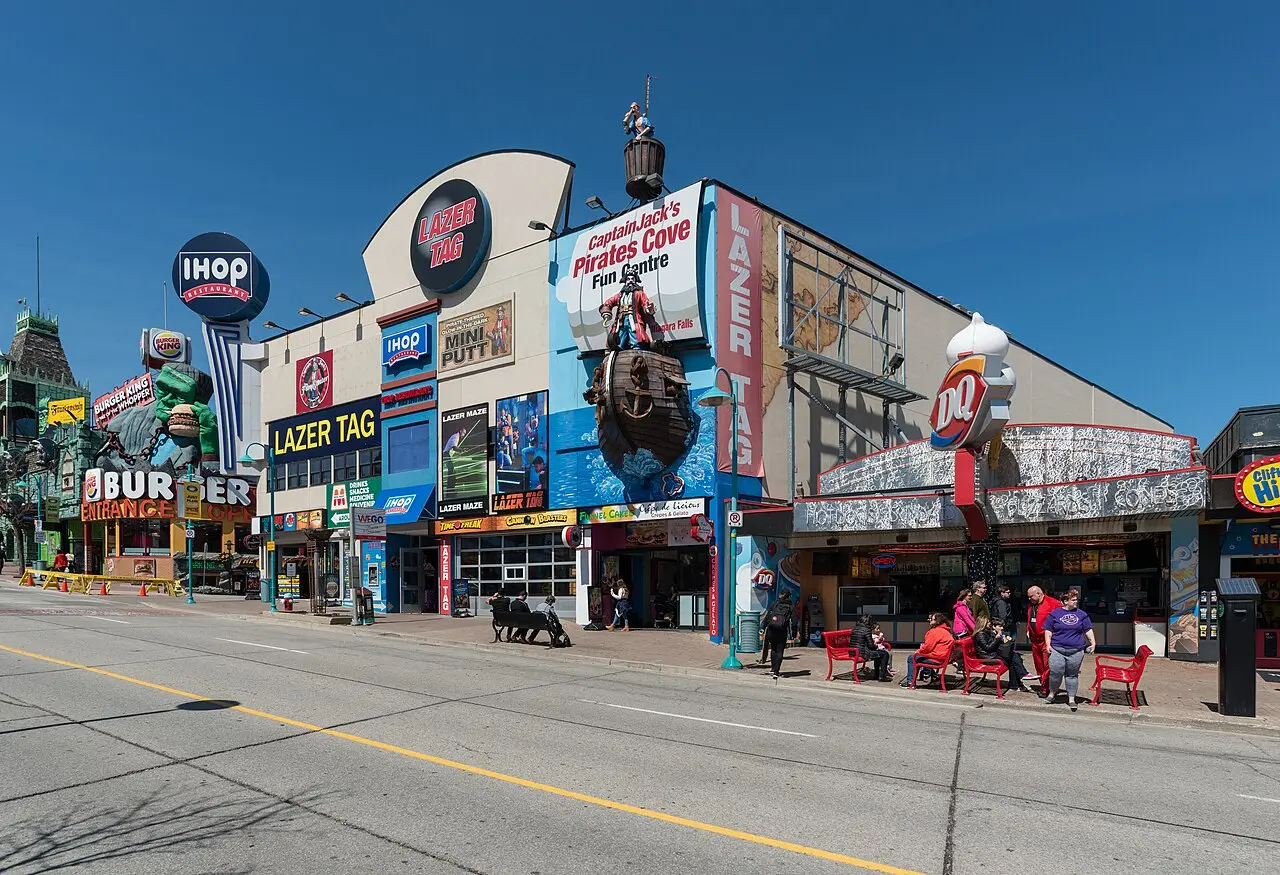 Crowds and restaurant signs along Clifton Hill at Niagara Falls, Ontario