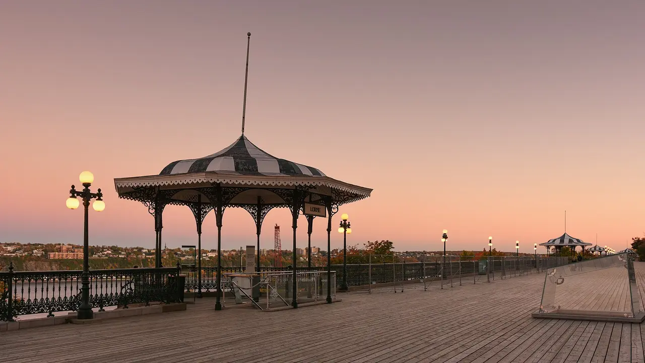 The wooden boardwalk of Terrasse Dufferin above the St Lawrence River at dusk in Quebec City