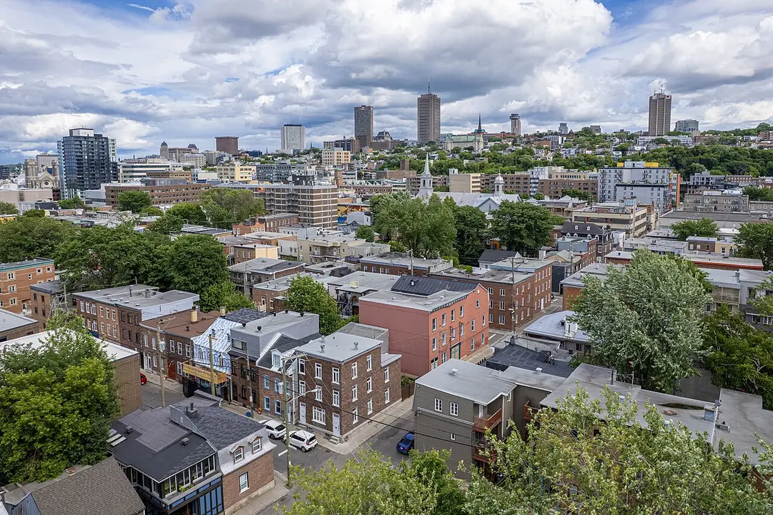 Rooftops of the Saint-Roch district of Quebec City with the modern downtown behind