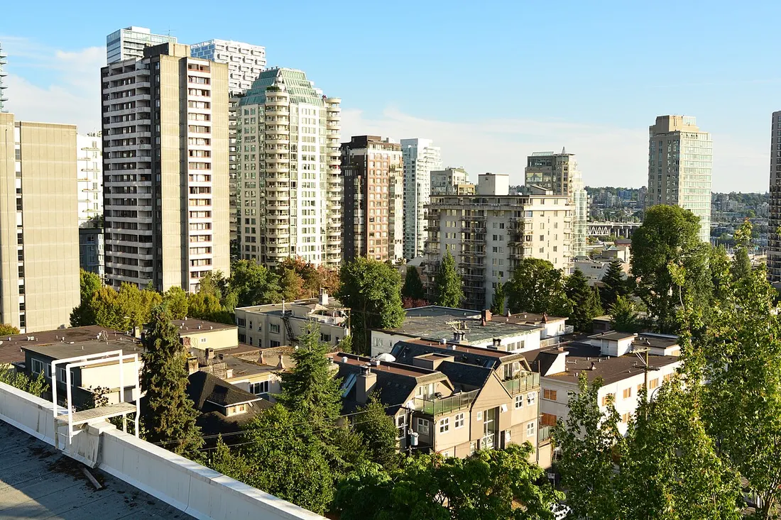 Low-rise apartment buildings on a leafy residential street in Vancouver's West End