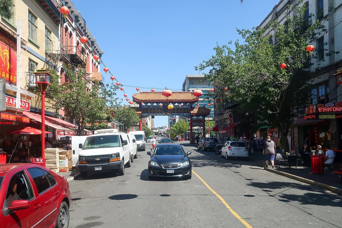 The gate and painted storefronts of Chinatown in Victoria's Old Town