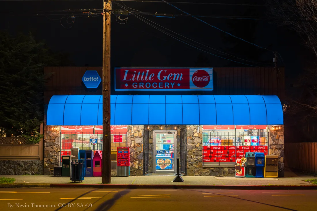 A quiet residential street corner with a small grocery in the James Bay neighbourhood of Victoria
