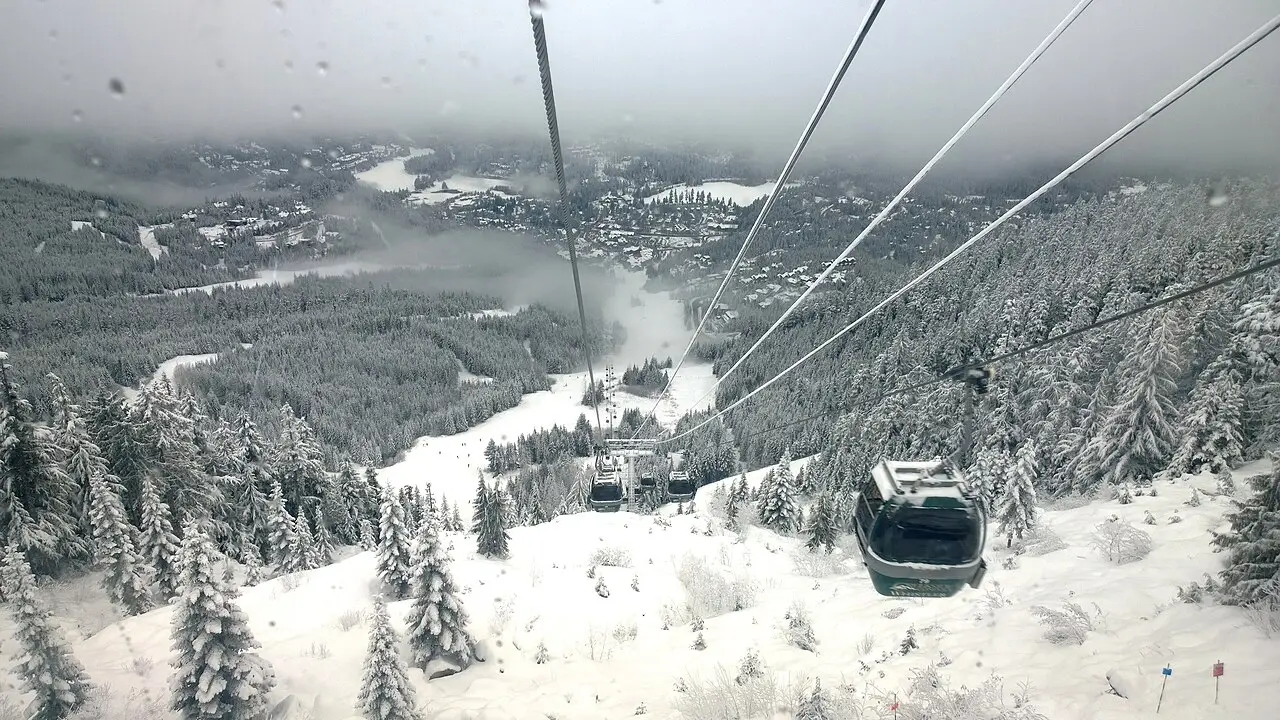 View down toward Whistler Creekside and the valley from inside the Creekside Gondola in winter