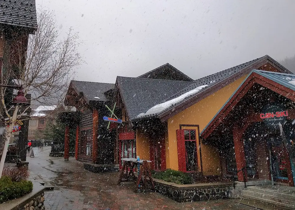 Snow falling over the small neighbourhood of Whistler Creekside in winter