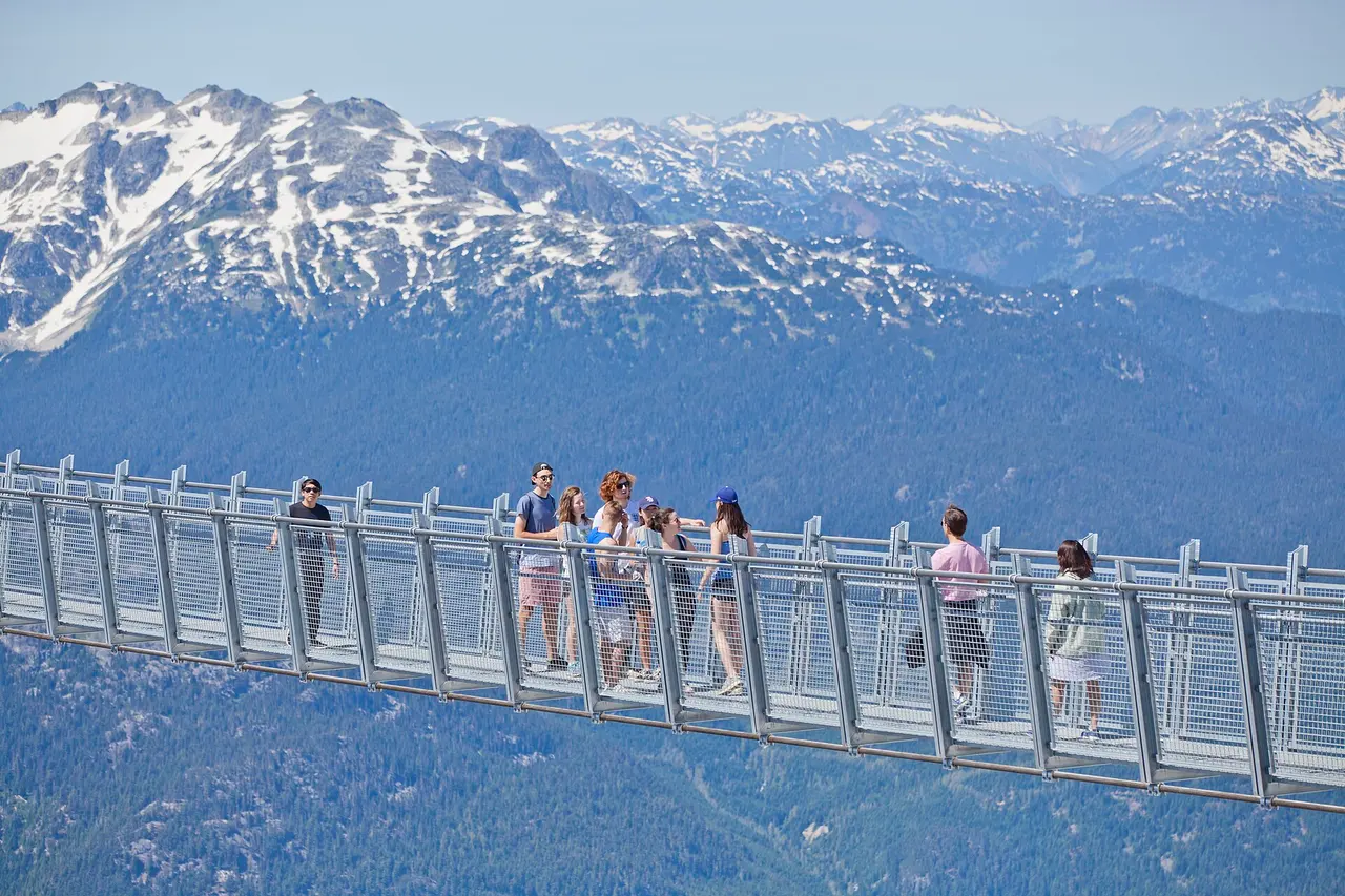 The Cloudraker Skybridge suspension bridge spanning a gap on Whistler Peak