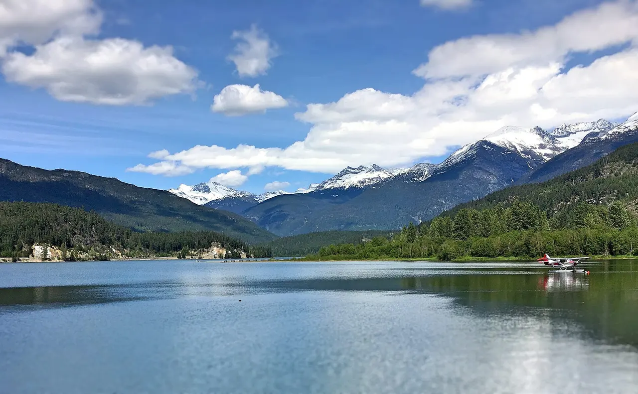 The turquoise water of Green Lake with Whistler valley behind it in summer