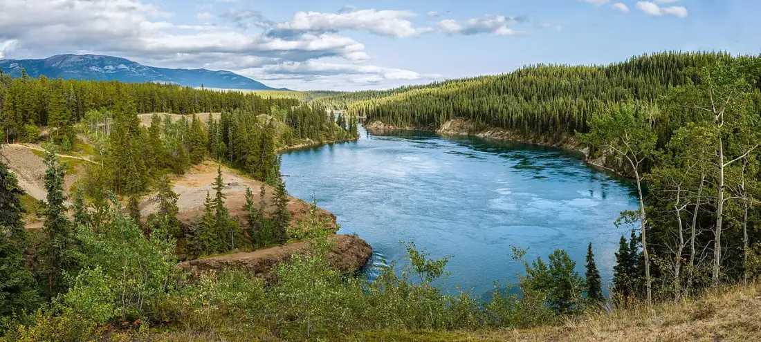 Basalt cliffs of Miles Canyon framing the Yukon River near Whitehorse