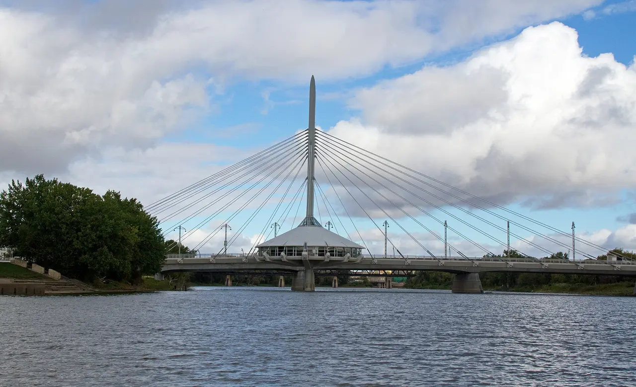 The white cable-stayed Esplanade Riel pedestrian bridge over the Red River in Winnipeg