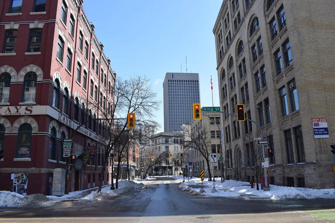 Century-old brick and stone warehouse buildings lining Bannatyne Avenue in Winnipeg's Exchange District